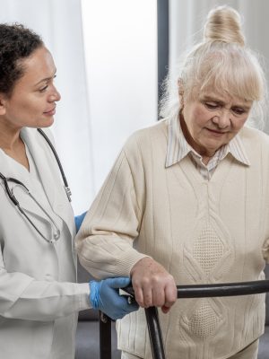 senior-woman-standing-indoors-doctor